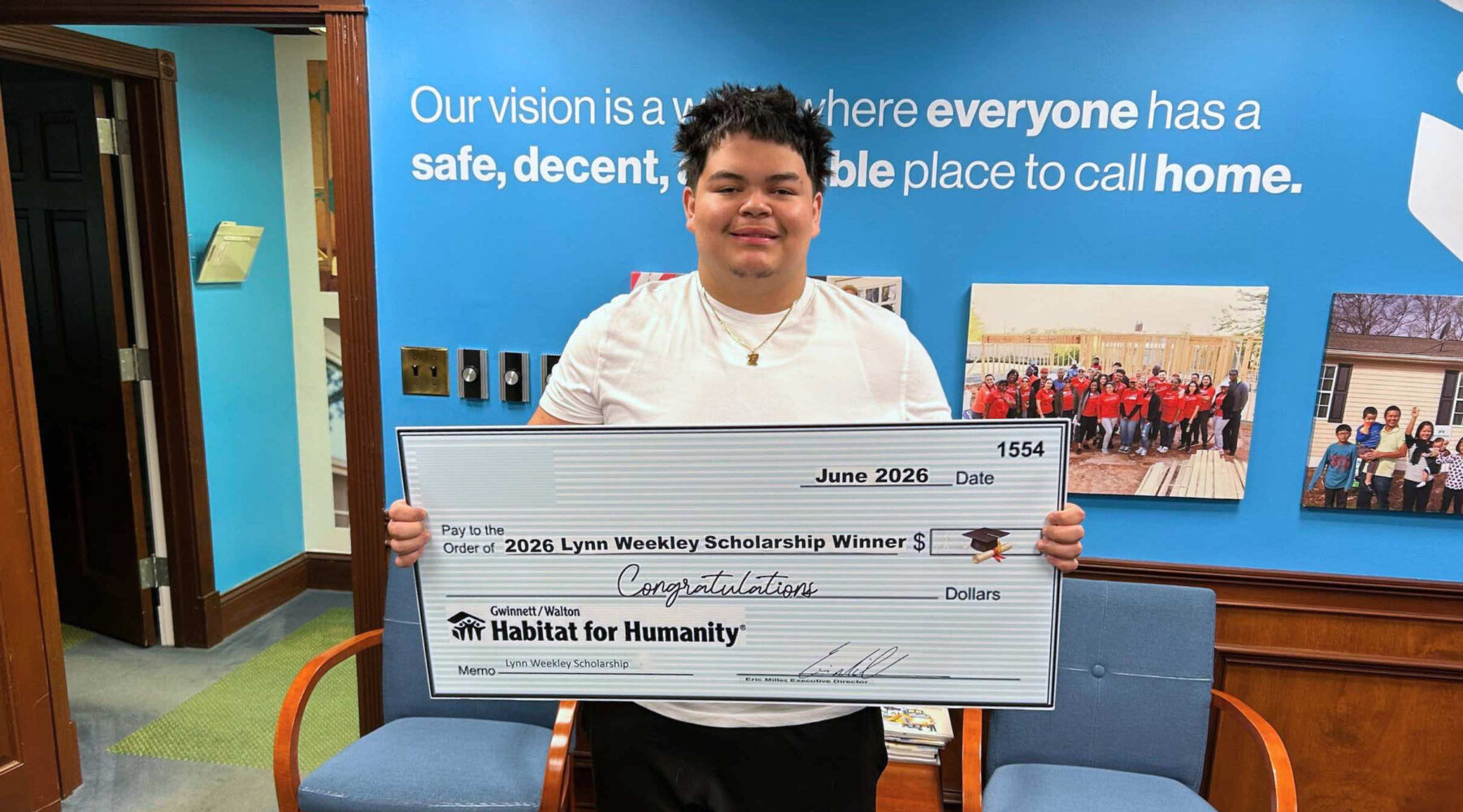 2026 award recipient, Yail, holding award check.